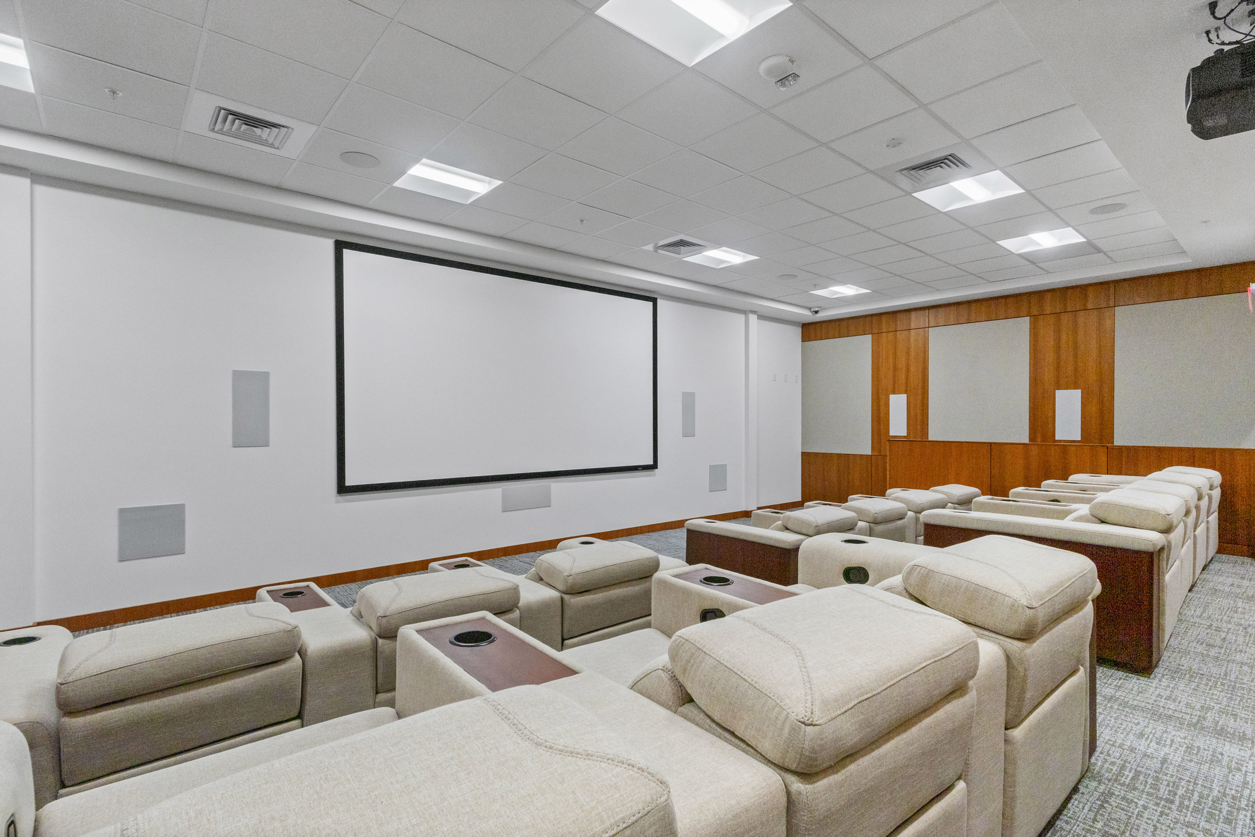Private theater room with plush recliners and big-screen movie nights