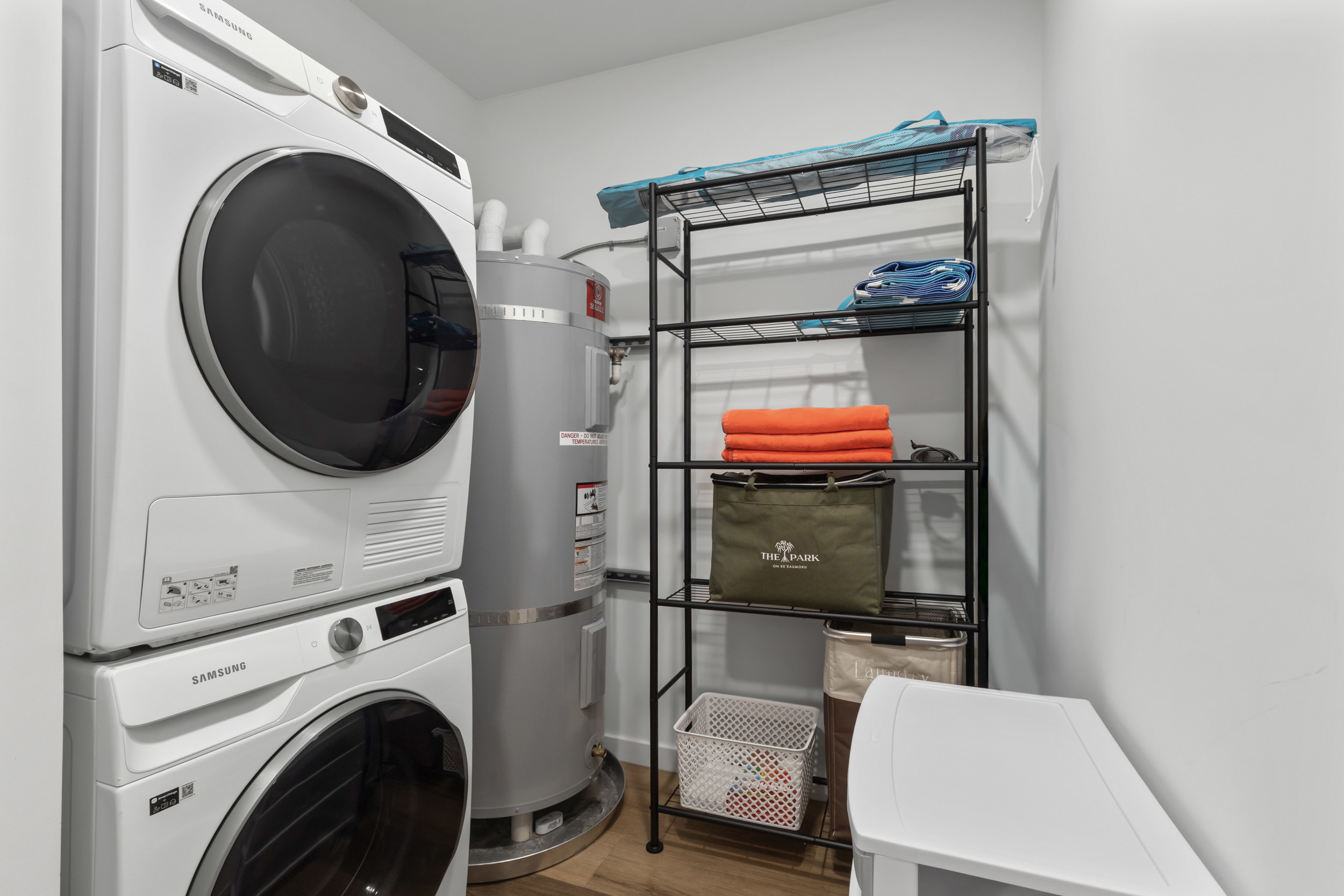 Convenient in-home laundry room with washer, dryer, and organized storage