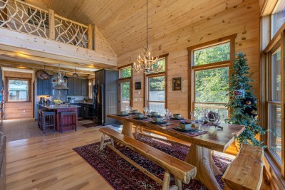 The open dining space at Rested Traveler is stunning — soaring ceilings, an open loft above, and sun-filled windows flood the room with natural light and create a warm and breathtaking setting for every meal.