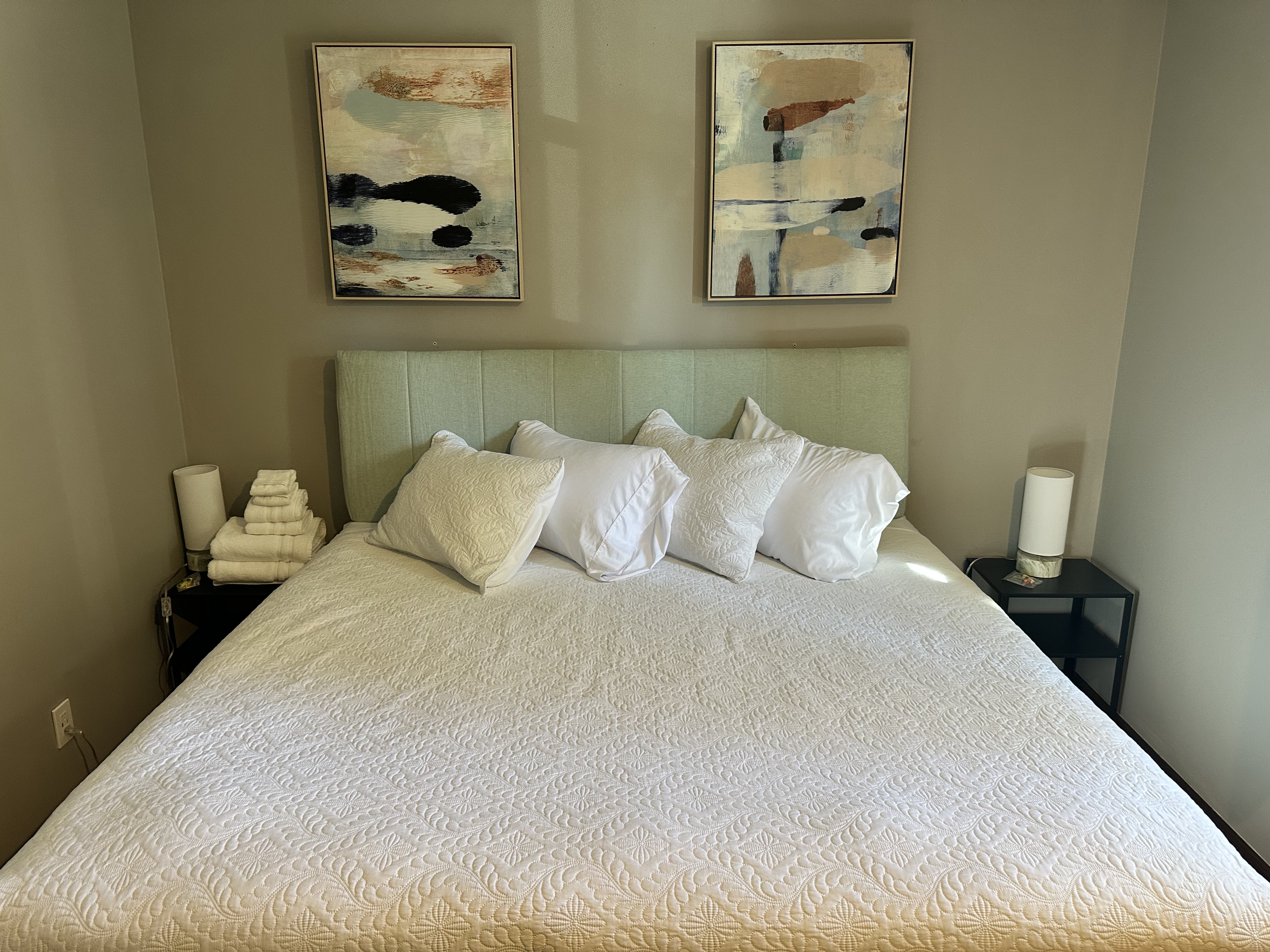 Bright, modern bedroom with plush bedding and calming decor