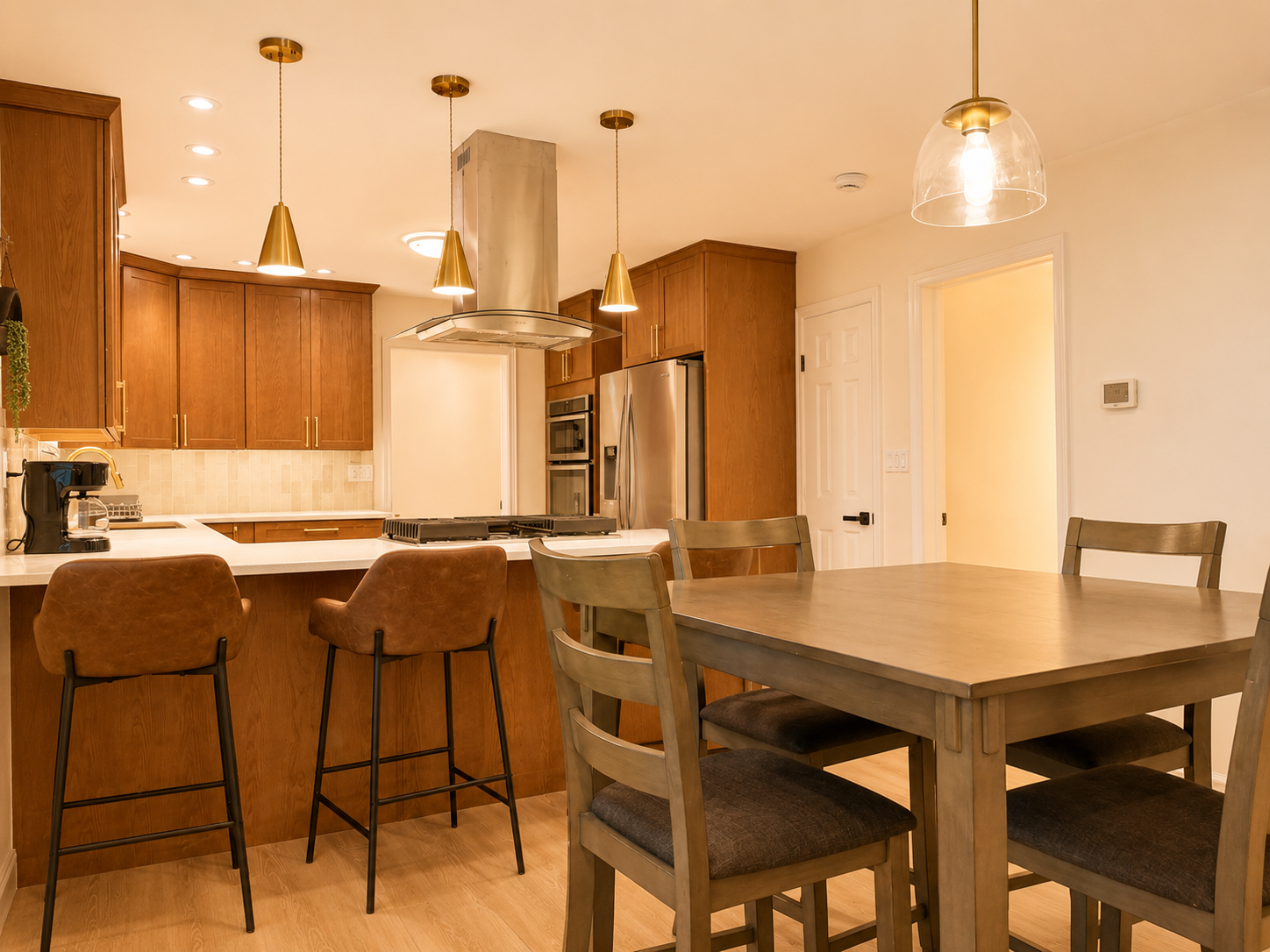 Bright modern kitchen with island seating and inviting dining area