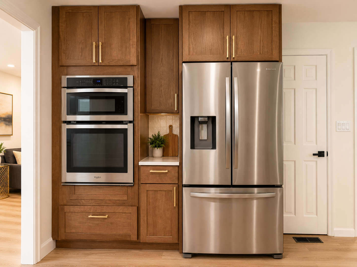 Stylish kitchen with stainless appliances and warm custom cabinetry