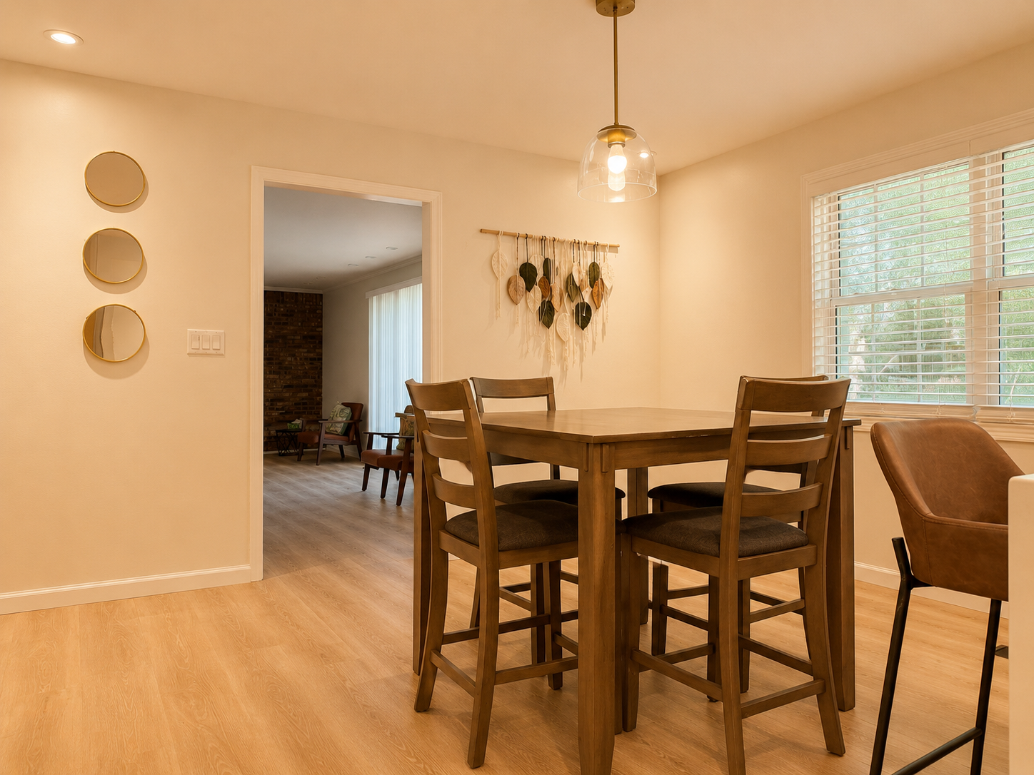 Bright dining nook with high-top seating and airy open-concept flow