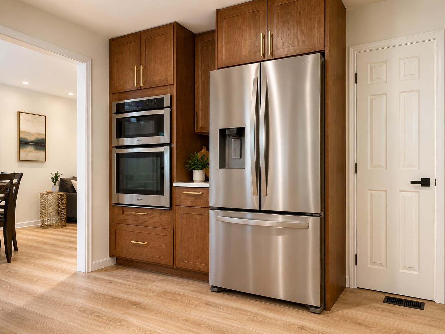 Modern kitchen with stainless appliances and warm wood cabinetry