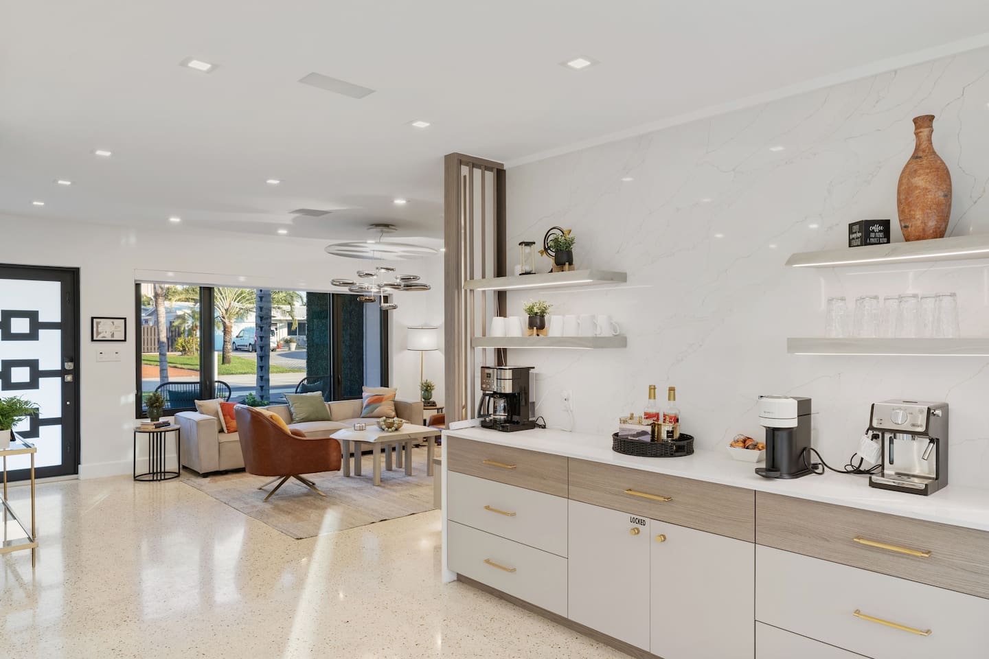 Prepare meals while remaining part of the conversation in this bright, open kitchen and coffee bar overlooking the comfortable living space. Enjoy your morning coffee from the drip coffee machine, Nespresso or an Espresso machine