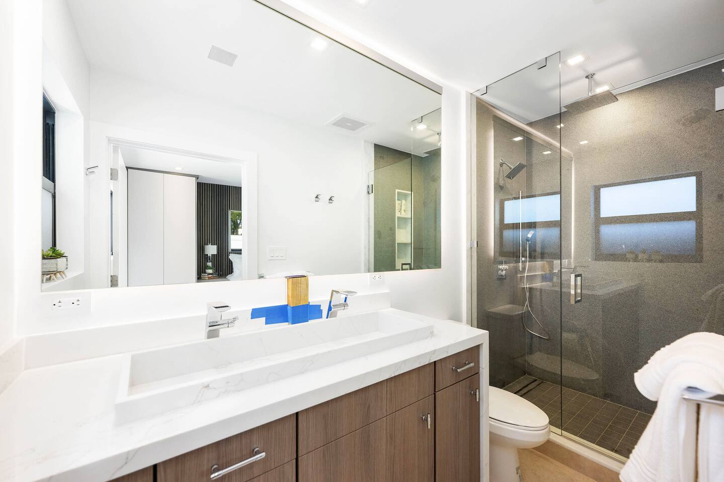 A nice-sized full bathroom with a walk-in shower