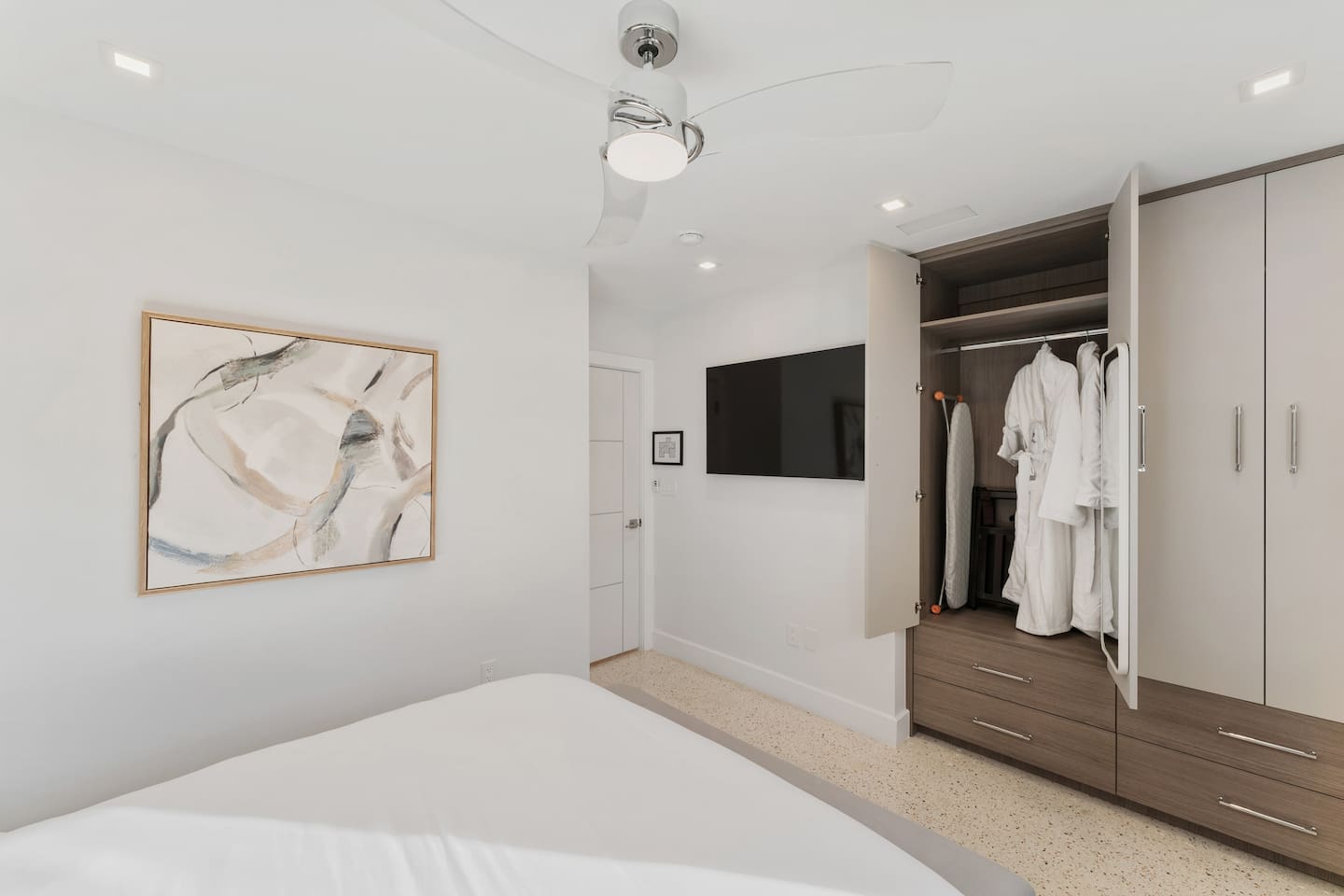 Relax in a comfortable queen-size bed with a TV and closet space for your convenience.