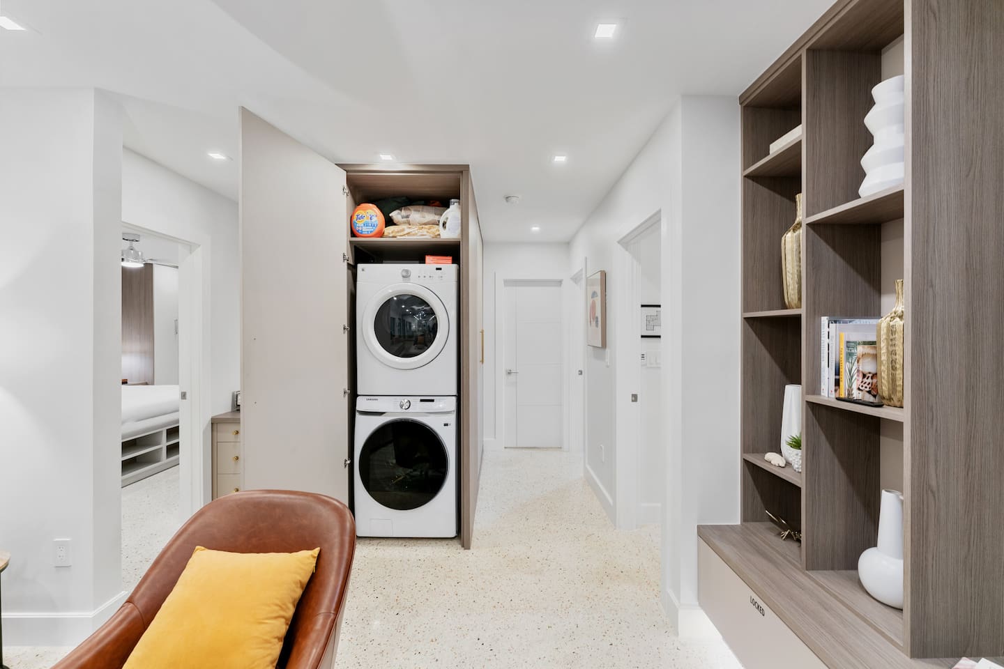 Relax in the living room while enjoying the convenience of a nearby laundry area with a full-size washer and dryer.