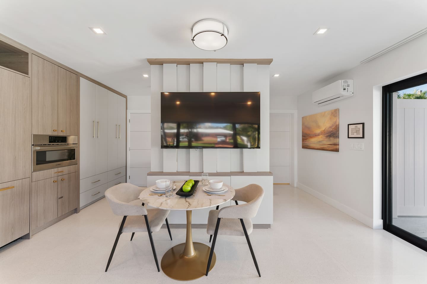 The intimate dining table for two offers the perfect spot to enjoy coffee, meals, or a relaxing evening in front of the TV.
