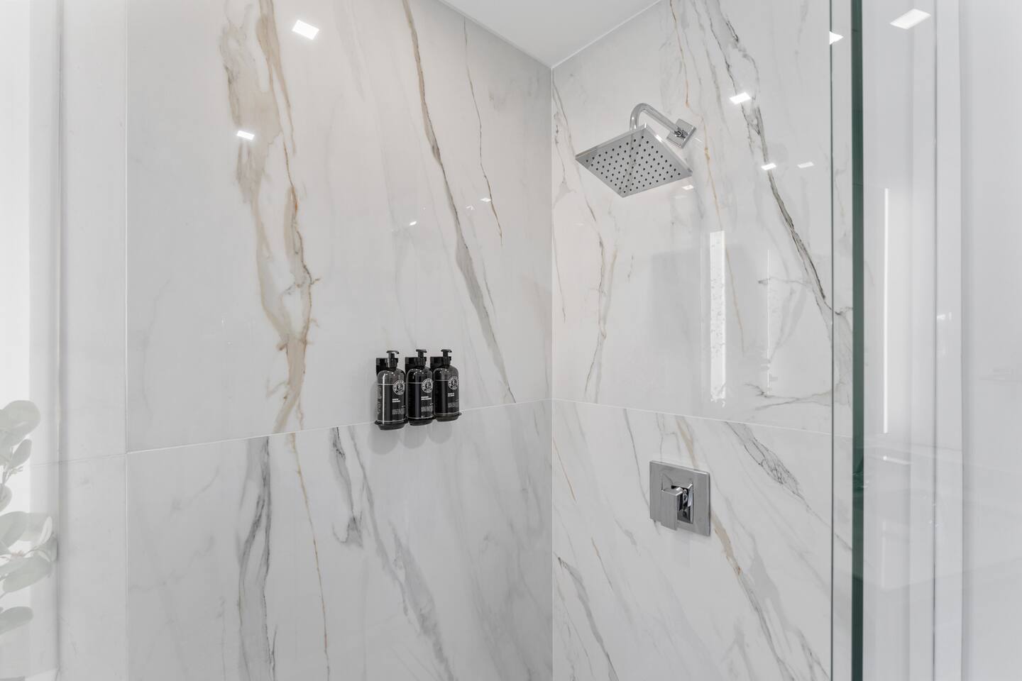 Enjoy the privacy of your own ensuite bathroom with a walk-in shower, modern fixtures, and fresh linens.