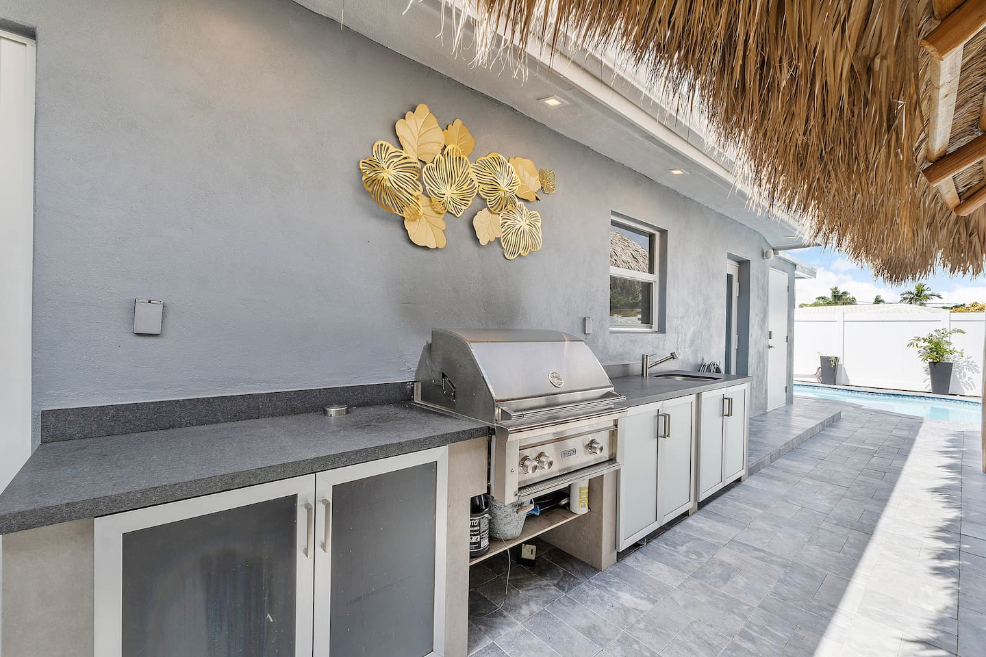 Fire up the BBQ grill and enjoy outdoor cooking with the convenience of a nearby outdoor sink for easy cleanup.