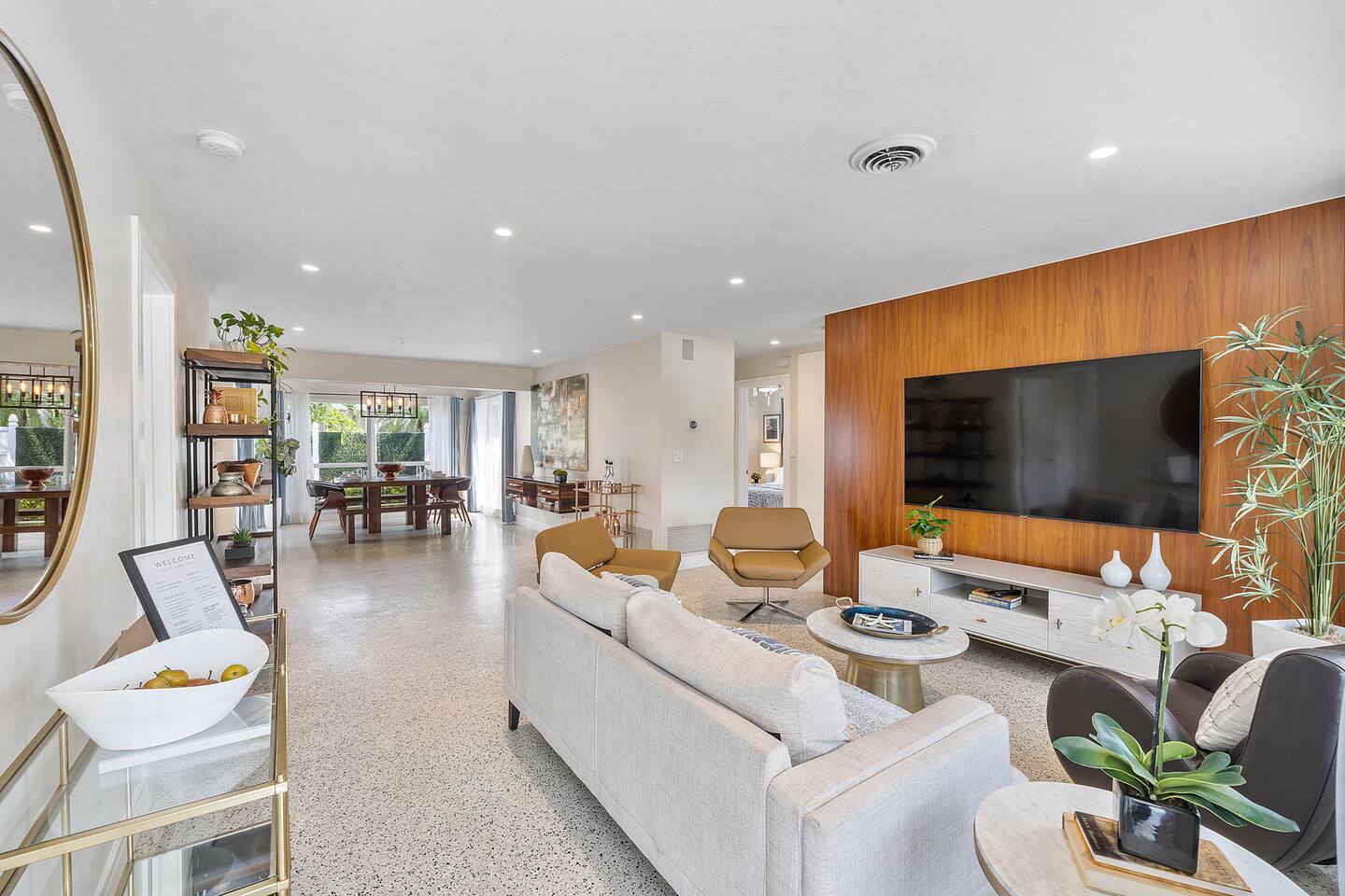 The living room offers the perfect balance of style and comfort, with modern décor, soft seating, and easy access to every main area of the home.