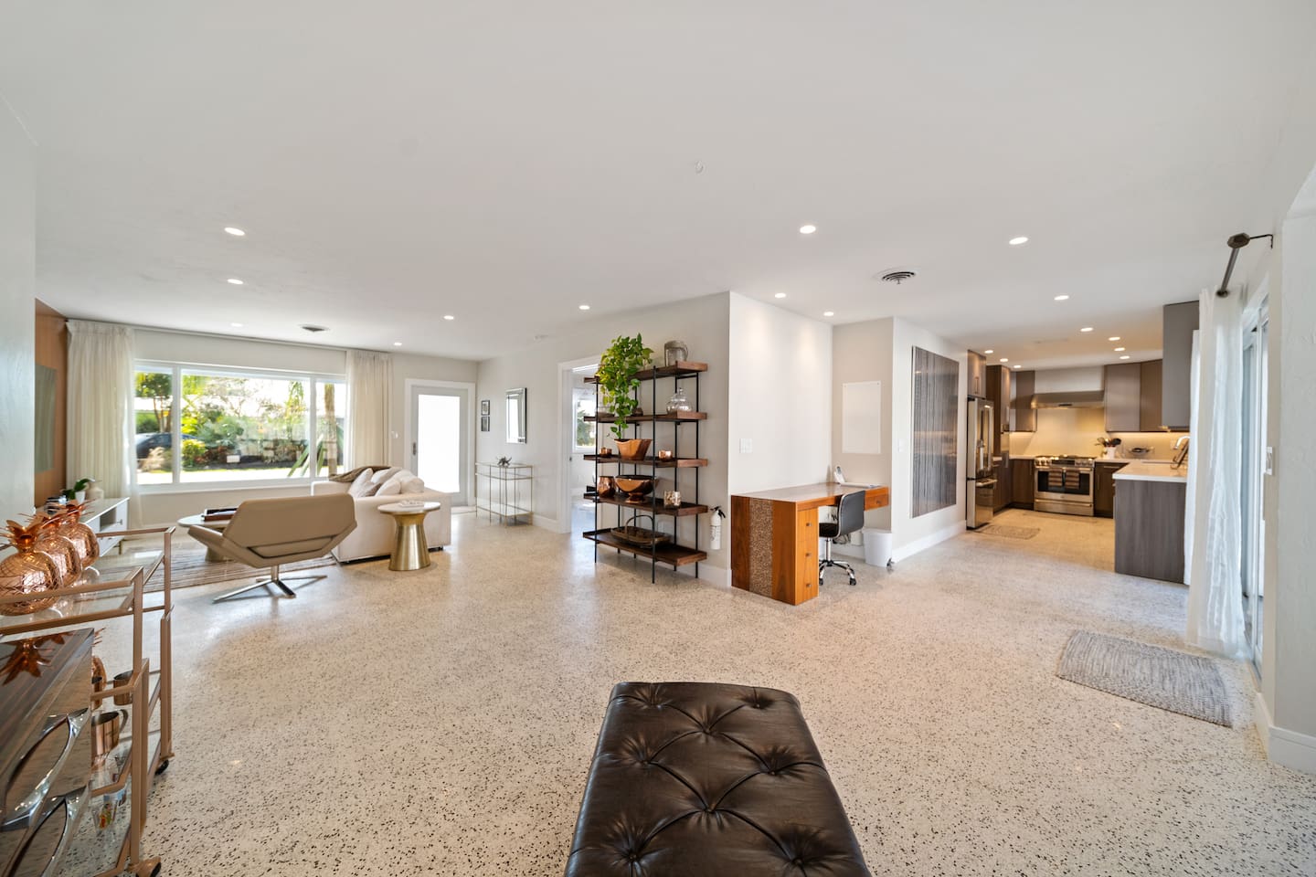 Entertain with ease thanks to the open-concept design connecting the living room, dining area, and fully stocked kitchen for effortless gatherings.