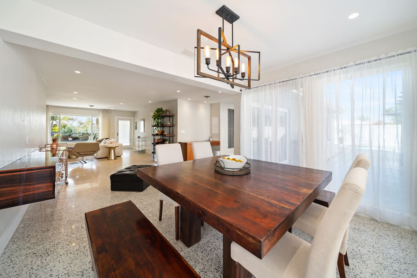 Enjoy effortless dining with a table perfectly positioned between the kitchen and living room, creating a seamless space for cooking, entertaining, and making memories.