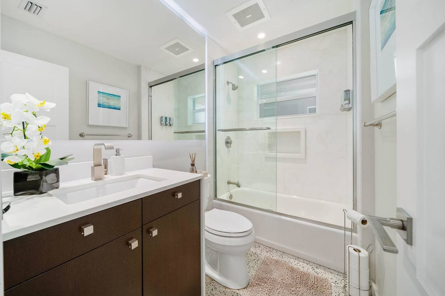 Another full bathroom in the home w/tub & shower combo & under-sink storage
