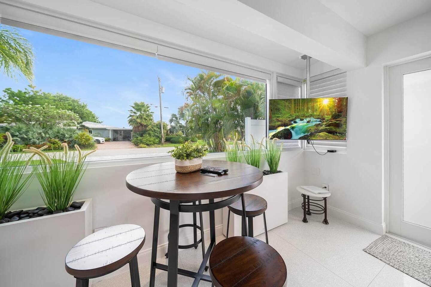 Wonderful natural light permeats the space. Here's the high-top table to dine in  or get some work done