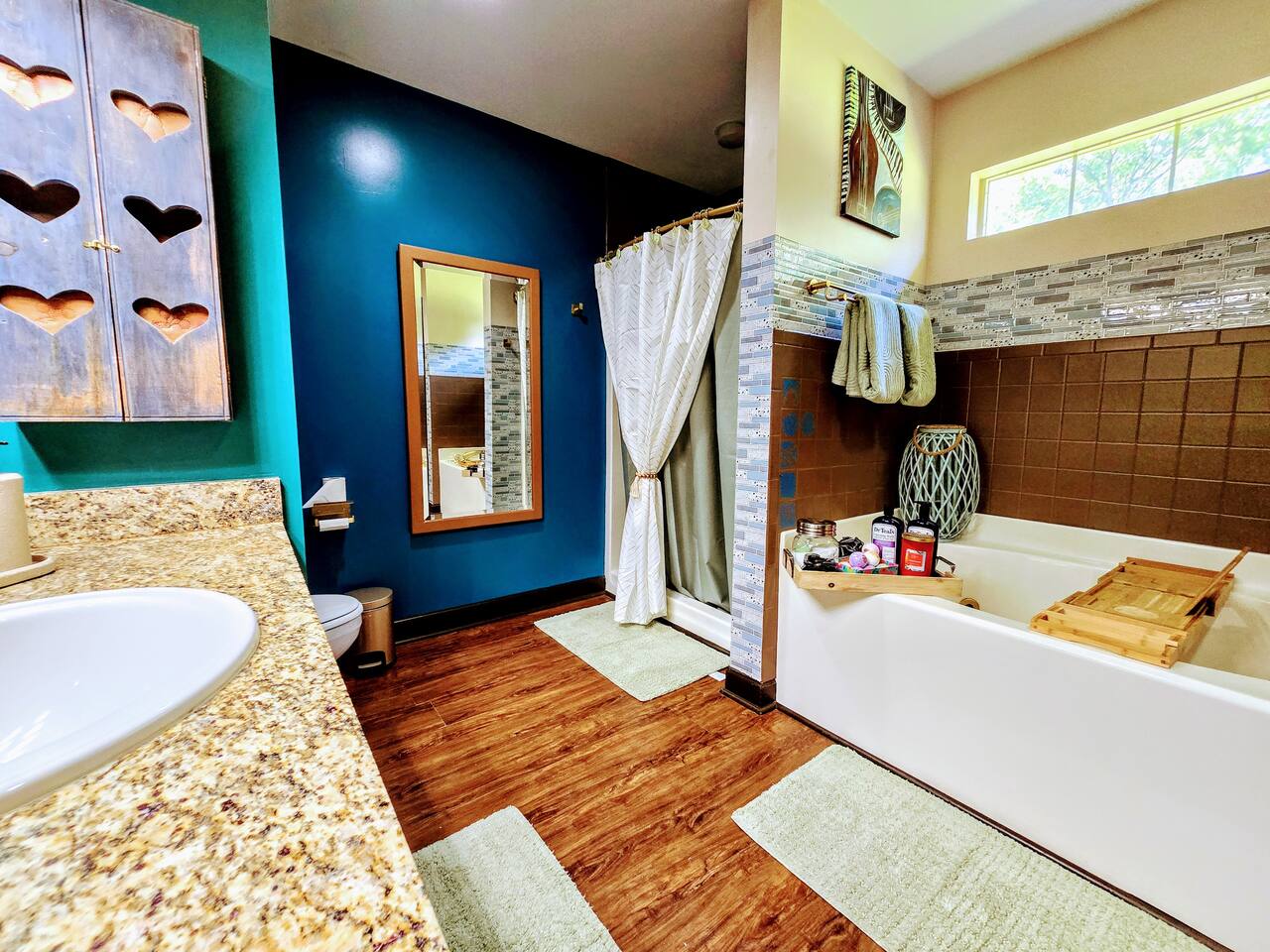 Relax, unwind, and customize your spa experience with your choice of salts, bombs, and scented candles. This spacious bathroom with walk-in closet is full of design and comfort features.
