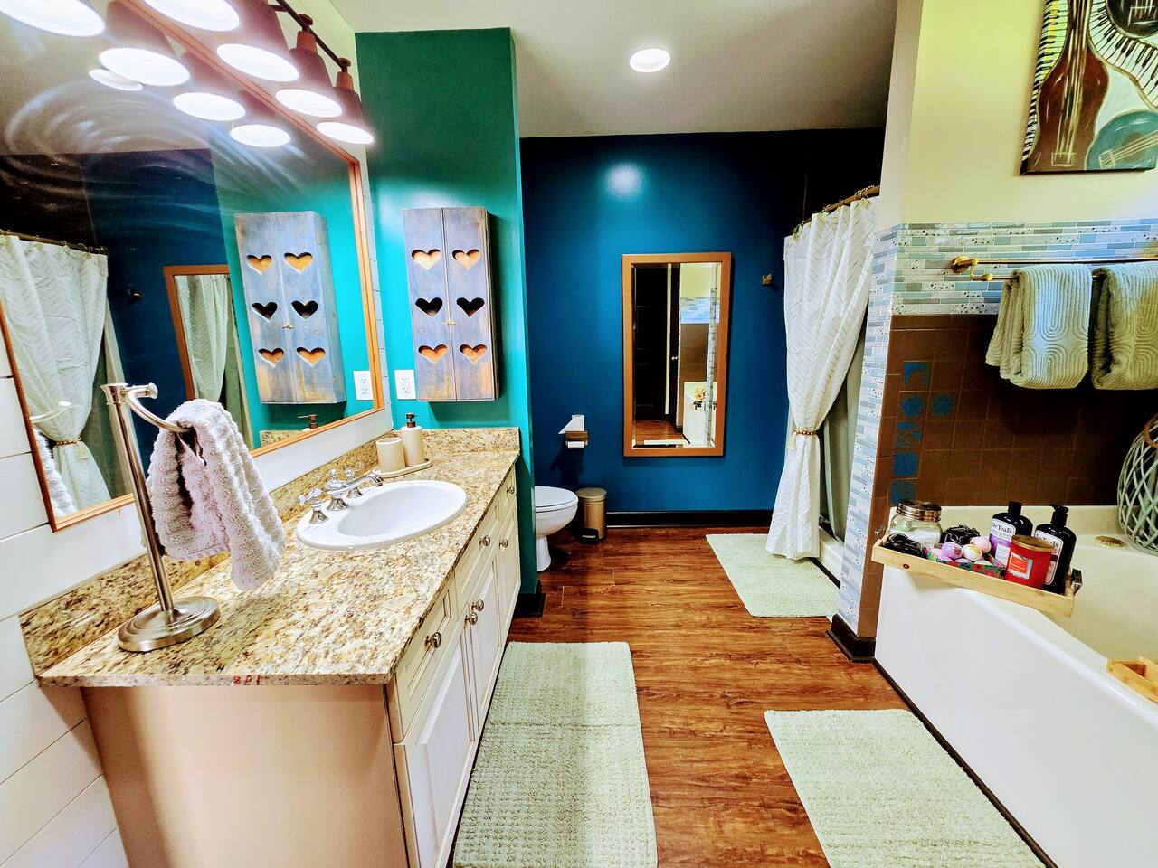Relax, unwind, and customize your spa experience with your choice of salts, bombs, and scented candles. This spacious bathroom with walk-in closet is full of design and comfort features.