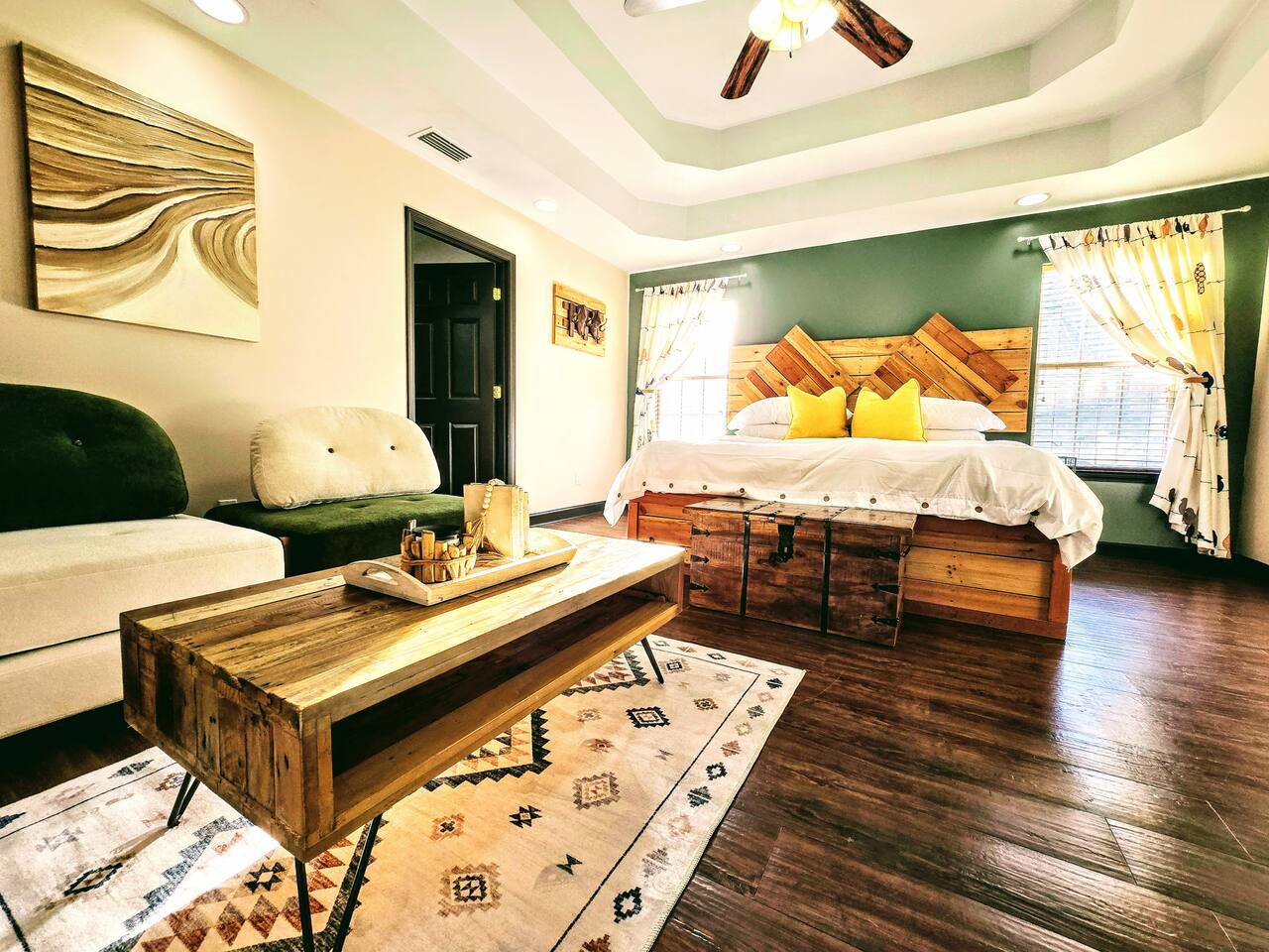Escape from the hustle and bustle of the rest of the house in your own private living area and bathroom. Catch up on some Zzzs in this one of a kind, homemade, pallet wood bed or enjoy a book or movie in this versatile imported furniture.