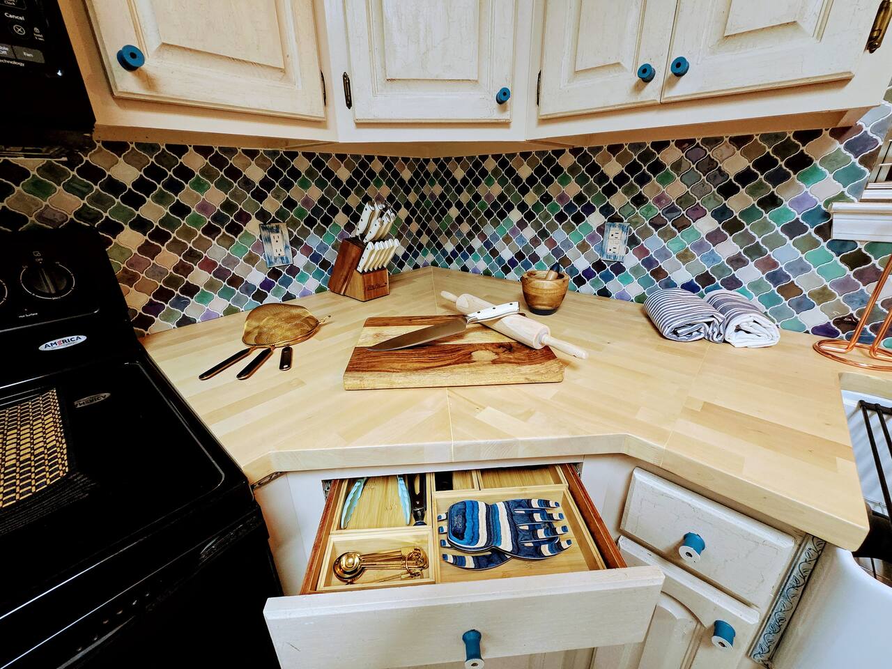 Relish in the custom everything in this delightful, fully loaded, kitchen! From the butcher block counter tops to cabinet trim and HUGE farmhouse sink, every apsect of this kitchen has been crafted for your cooking and gathering experience.