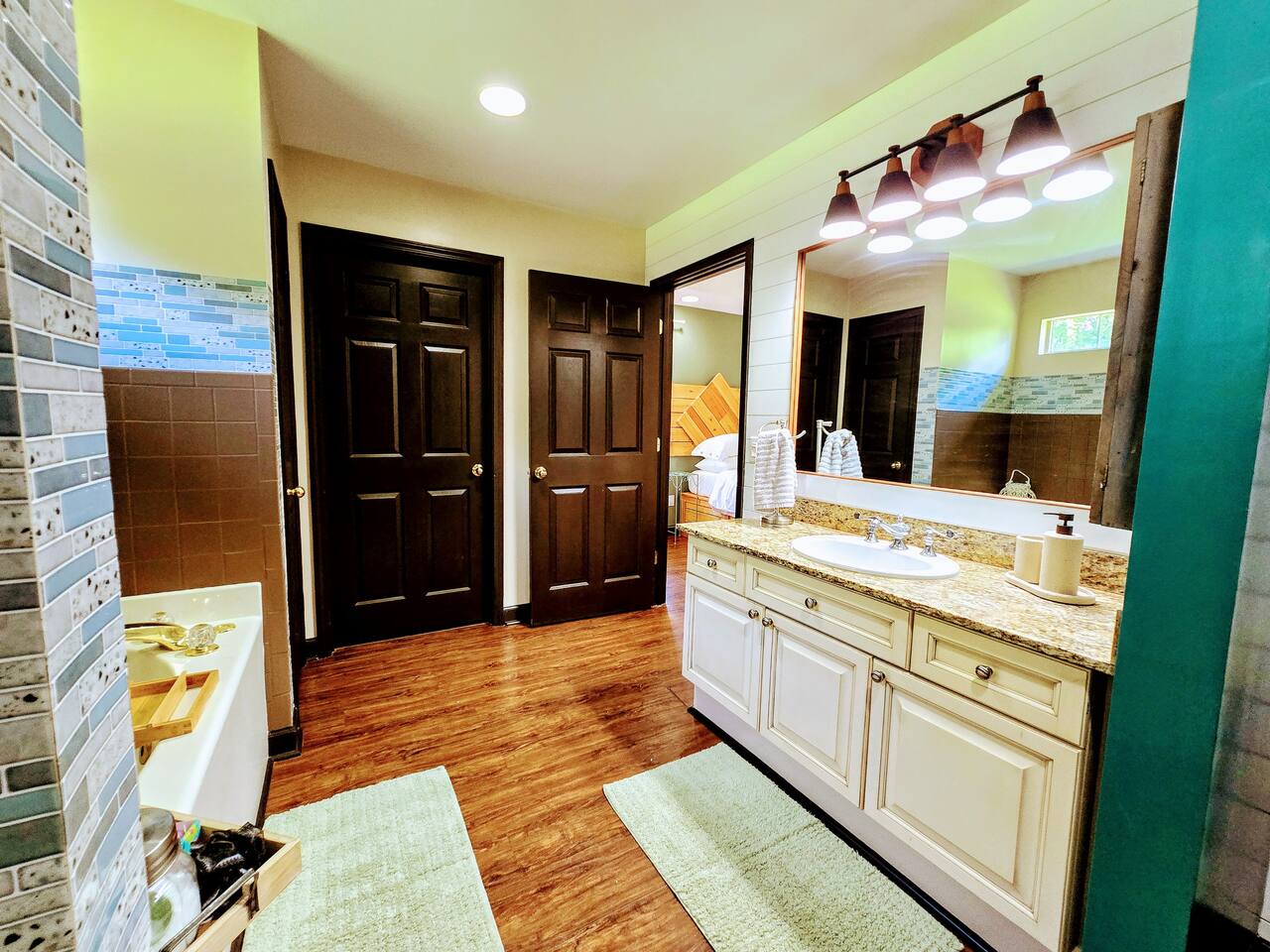 Relax, unwind, and customize your spa experience with your choice of salts, bombs, and scented candles. This spacious bathroom with walk-in closet is full of design and comfort features.