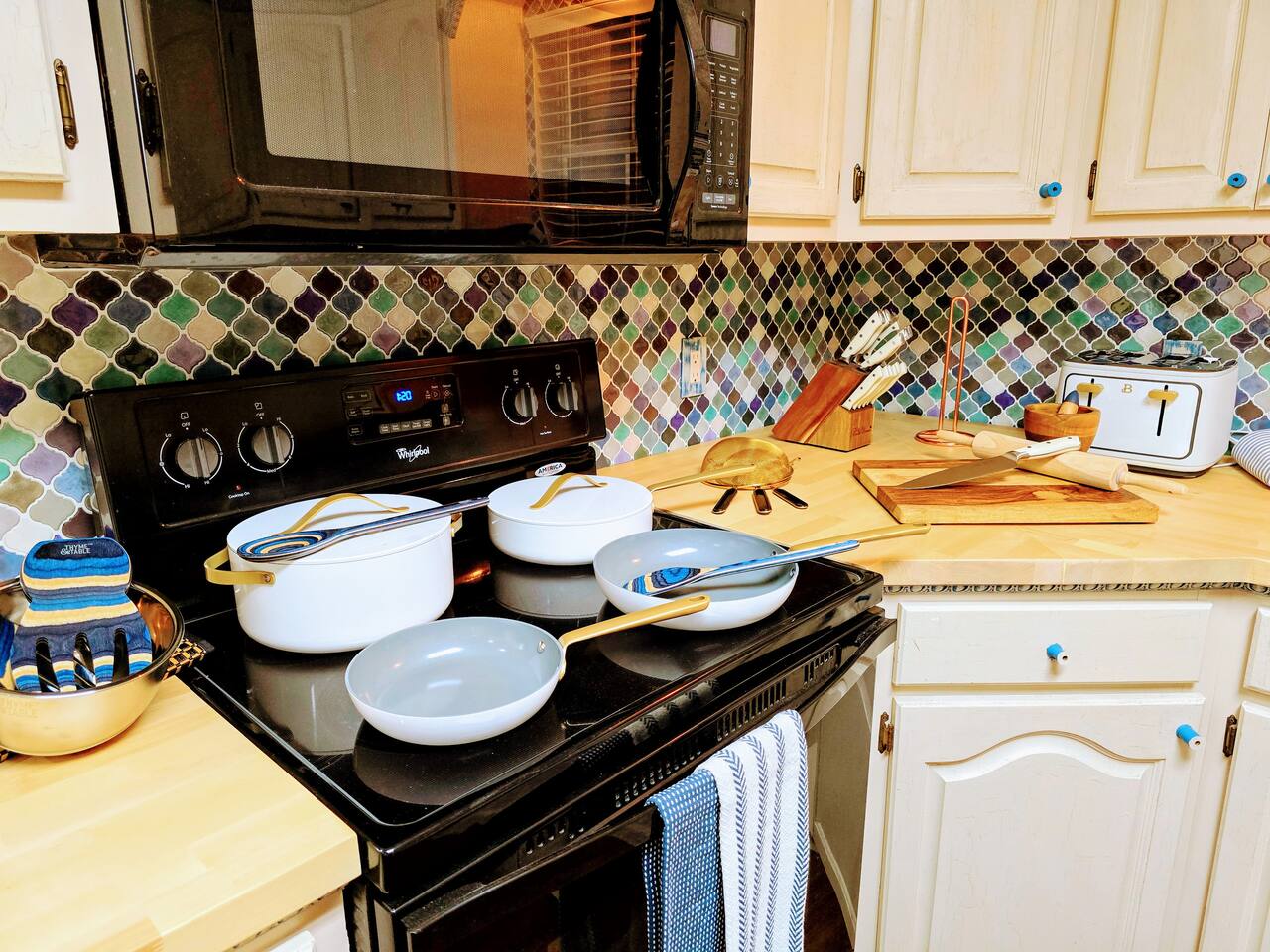 Relish in the custom everything in this delightful, fully loaded, kitchen! From the butcher block counter tops to cabinet trim and HUGE farmhouse sink, every apsect of this kitchen has been crafted for your cooking and gathering experience.