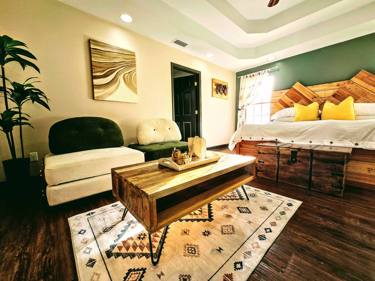 Escape from the hustle and bustle of the rest of the house in your own private living area and bathroom. Catch up on some Zzzs in this one of a kind, homemade, pallet wood bed or enjoy a book or movie in this versatile imported furniture.