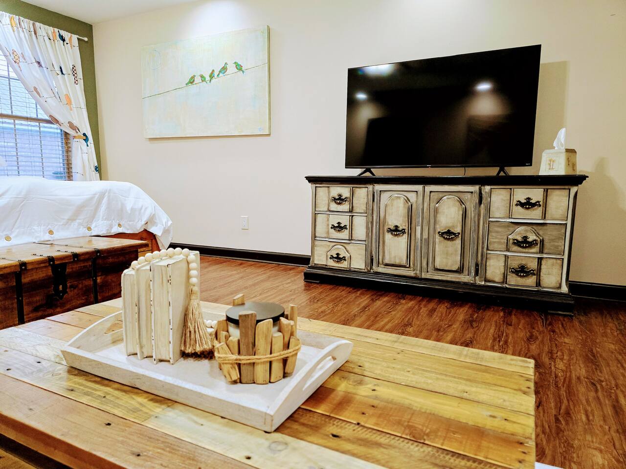 Escape from the hustle and bustle of the rest of the house in your own private living area and bathroom. Catch up on some Zzzs in this one of a kind, homemade, pallet wood bed or enjoy a book or movie in this versatile imported furniture.