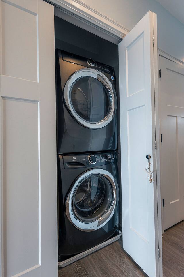 A stacking washer and dryer is available in the hallway just outside the bathroom.