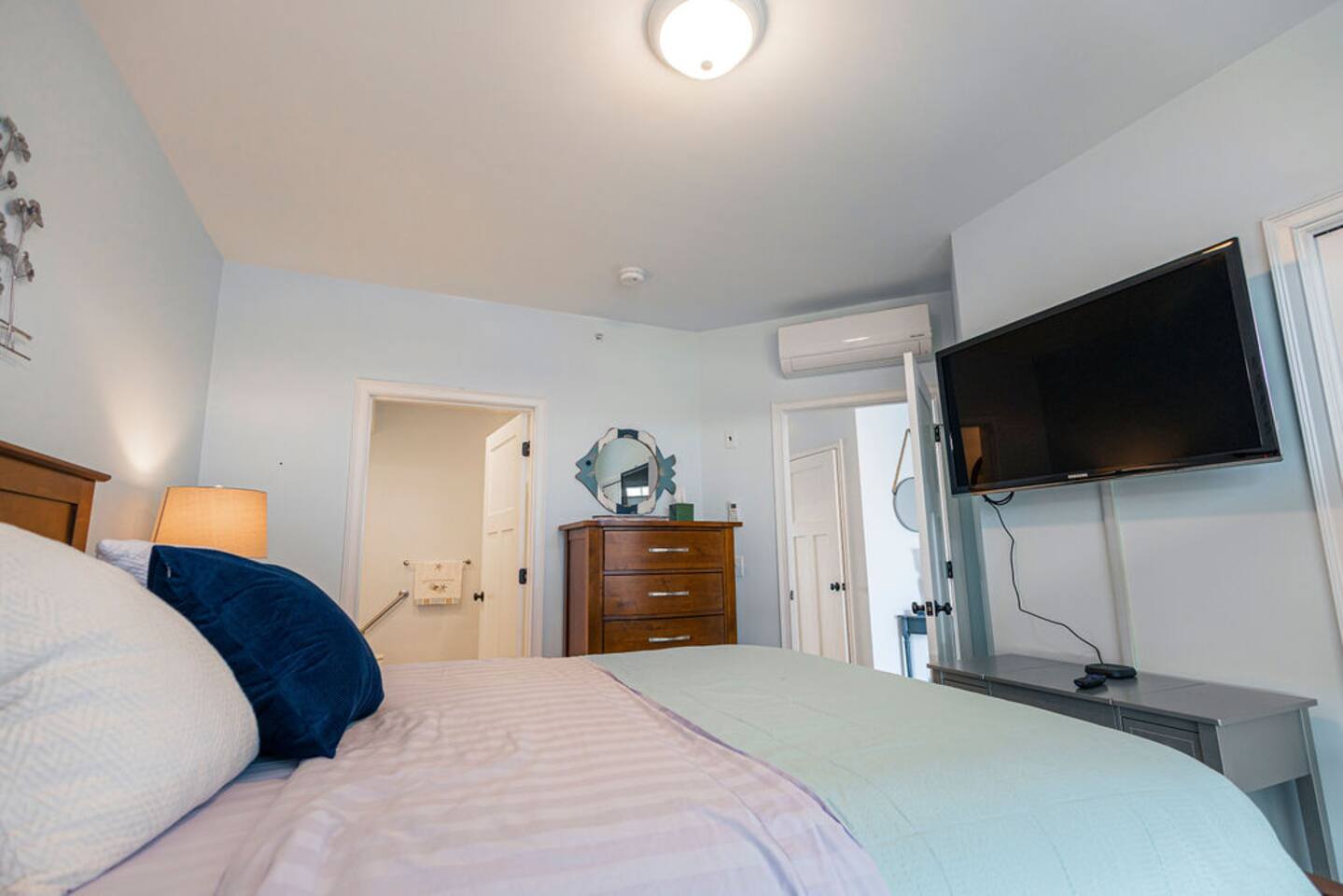 With a large tv, closet, plenty of storage and direct access to the bathroom, the bedroom has everything needed for a beautiful night's rest.