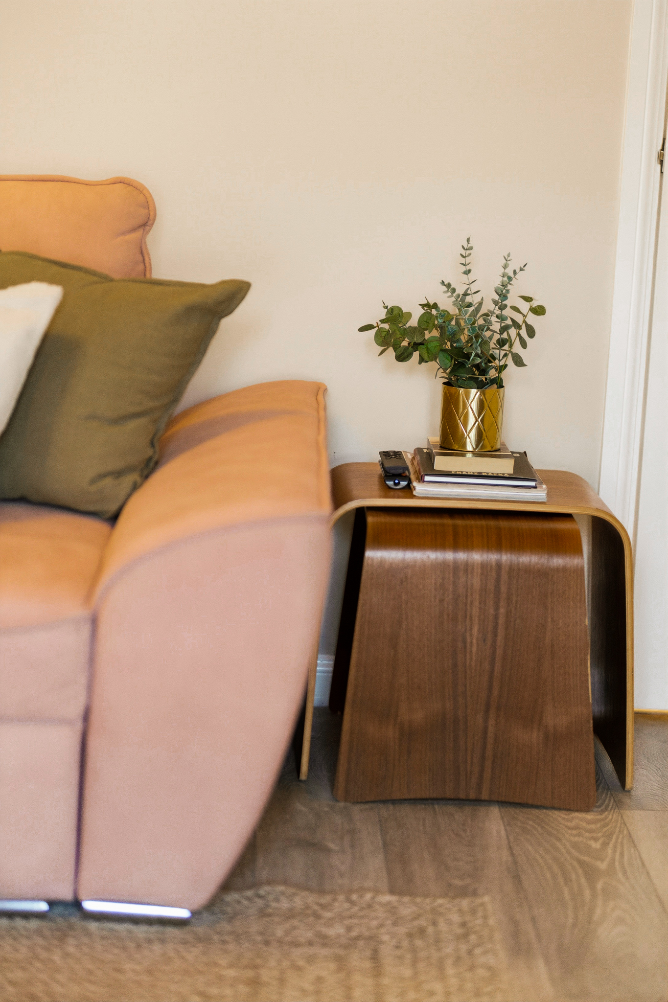 Cozy lounge corner with stylish sofa and modern wood side table