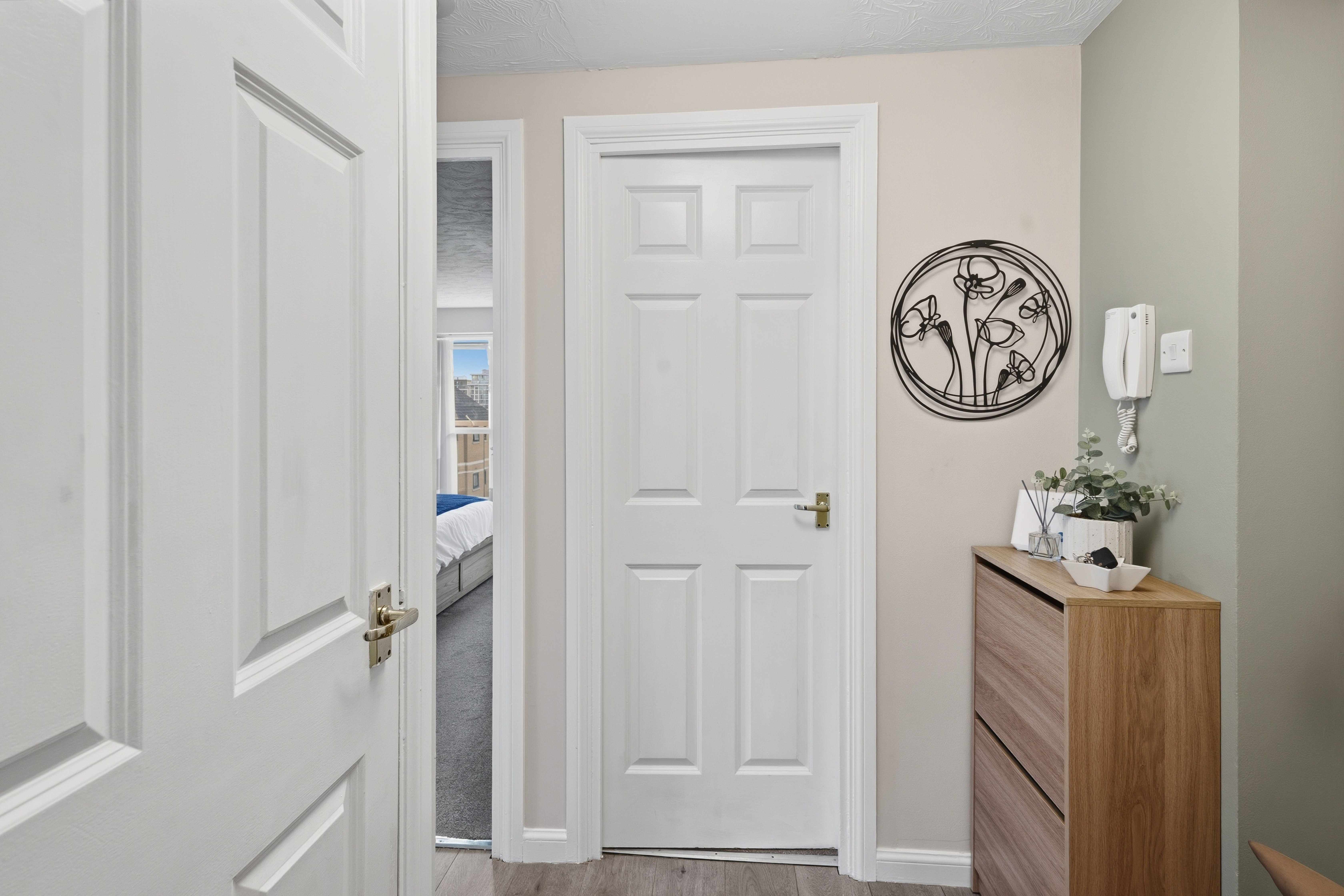 Bright, tidy hallway with stylish decor and smart storage