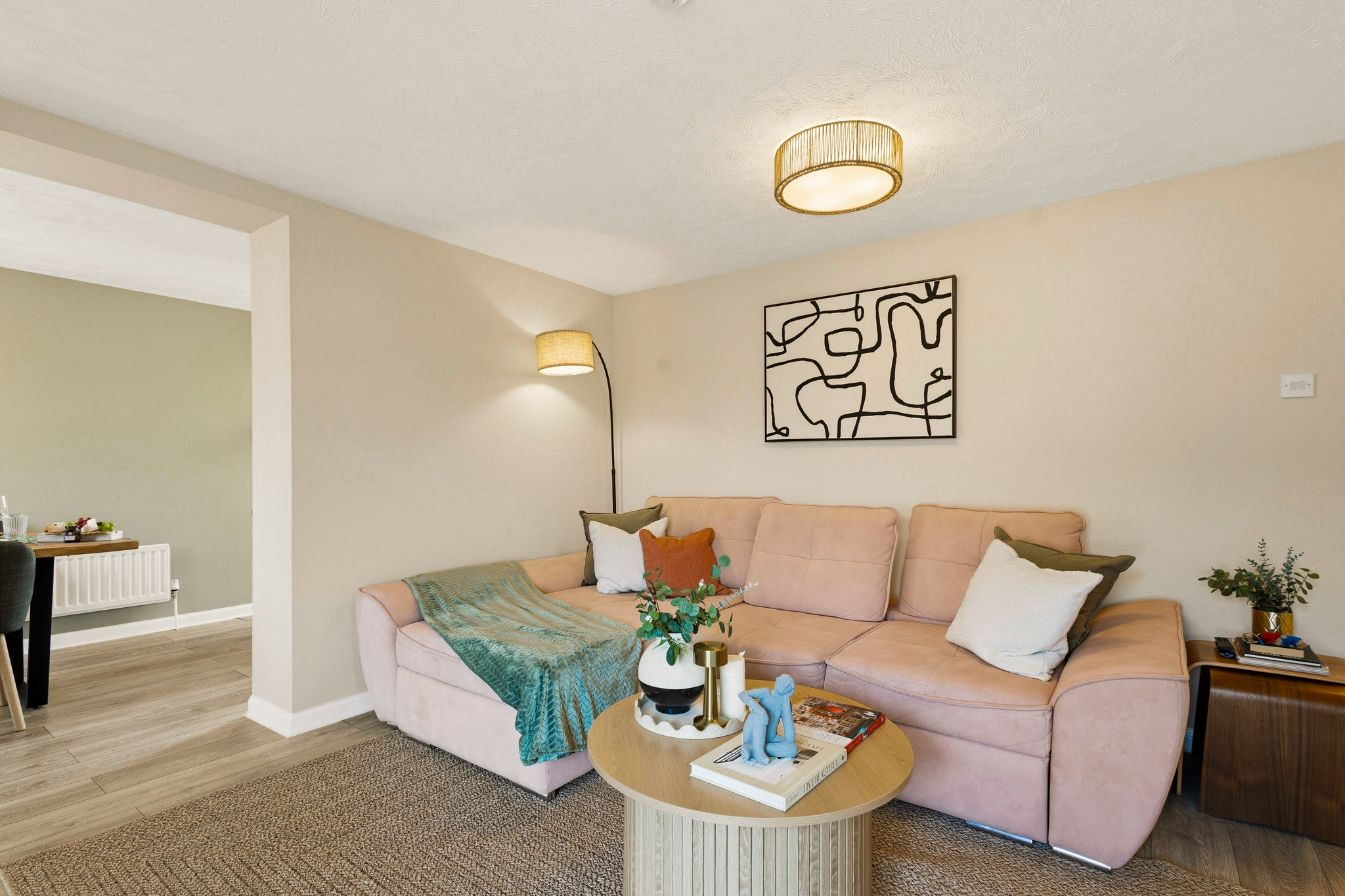 Bright, stylish lounge with plush sectional and modern decor