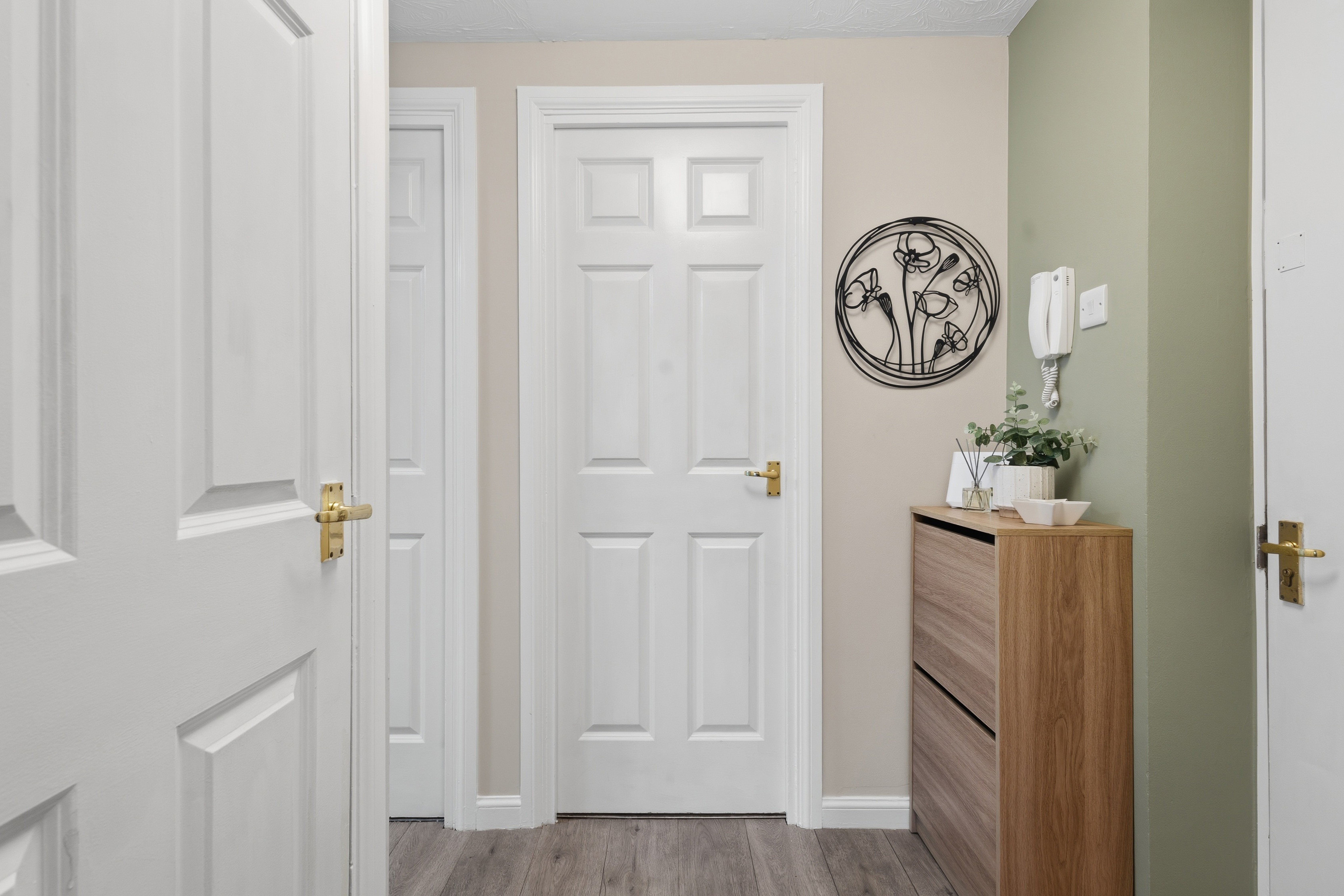 Bright, tidy hallway with stylish decor and handy storage