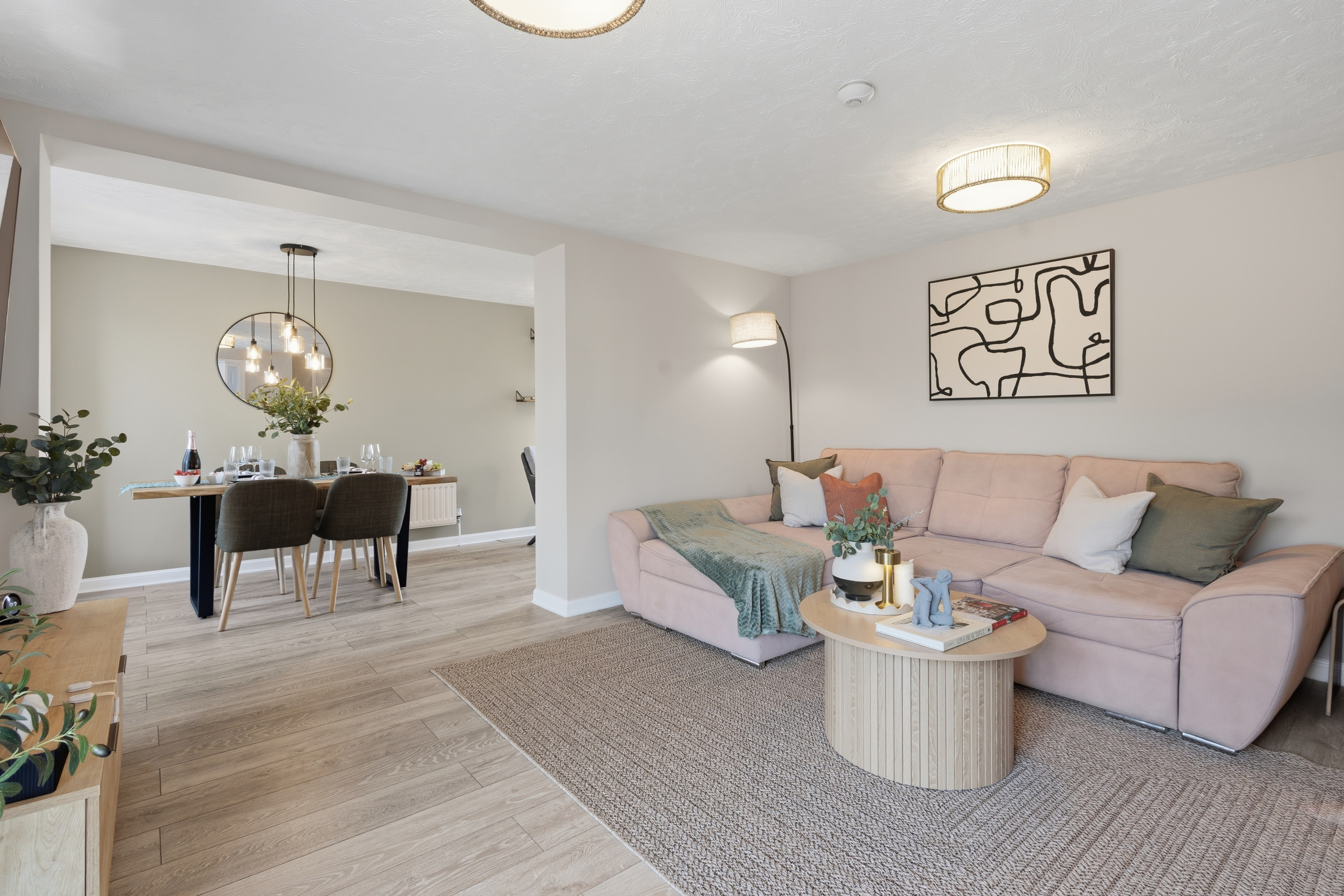 Bright open-plan lounge and dining space with stylish, cozy decor