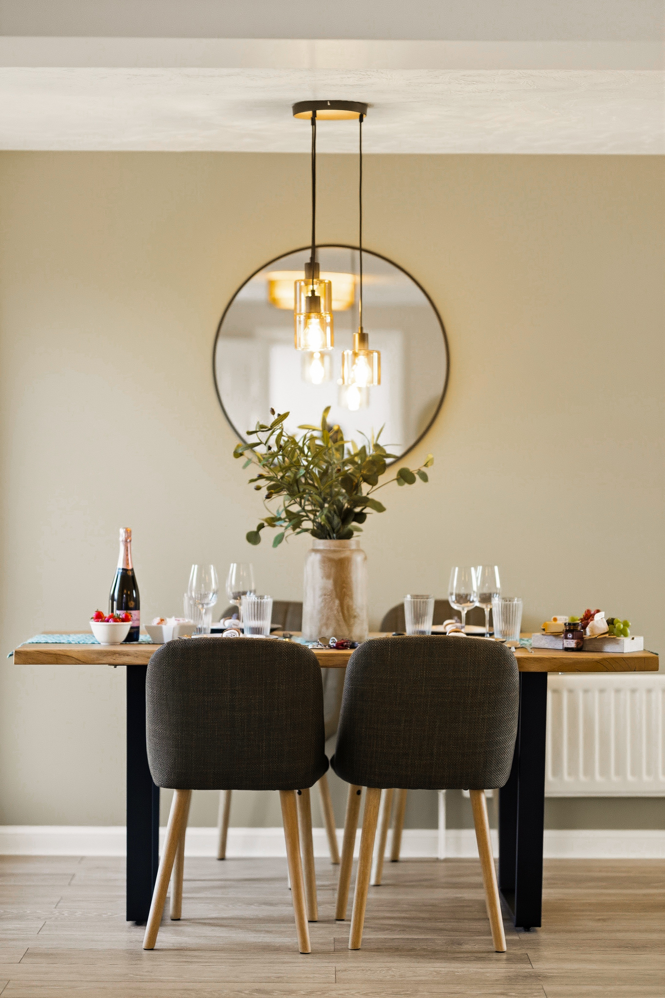 Stylish dining space with modern lighting and an inviting table setting