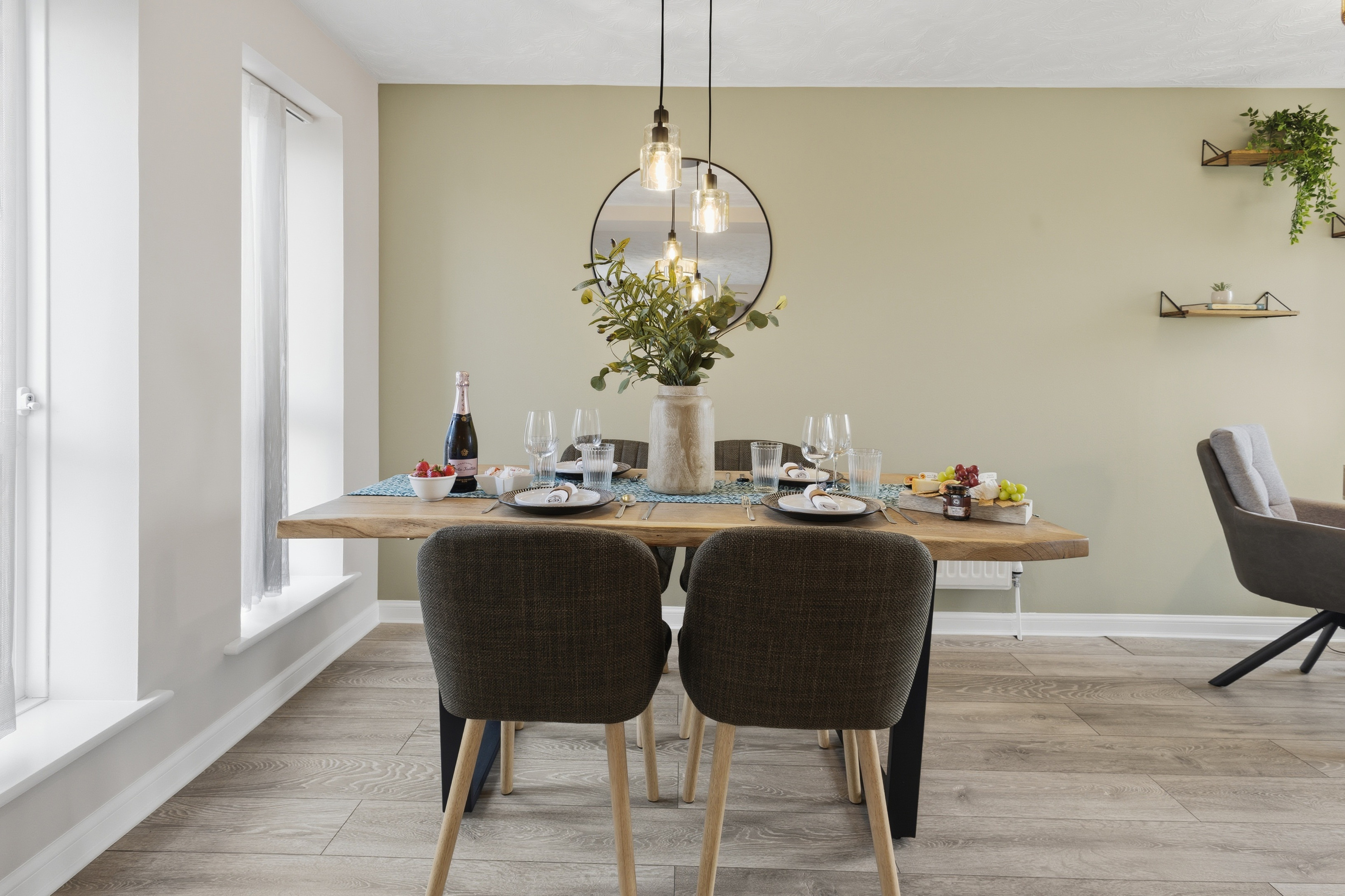 Bright modern dining area set for four with stylish, welcoming decor
