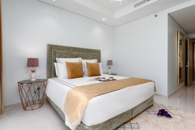 Bedroom 1 – king bed with gold accents