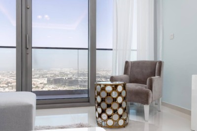 Armchair corner by the window with city views