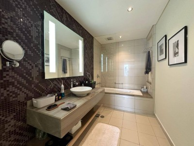 Bathroom with vanity and mirror