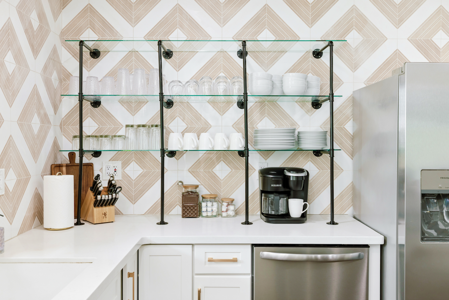 Coffee station with coffee maker and open glass shelving