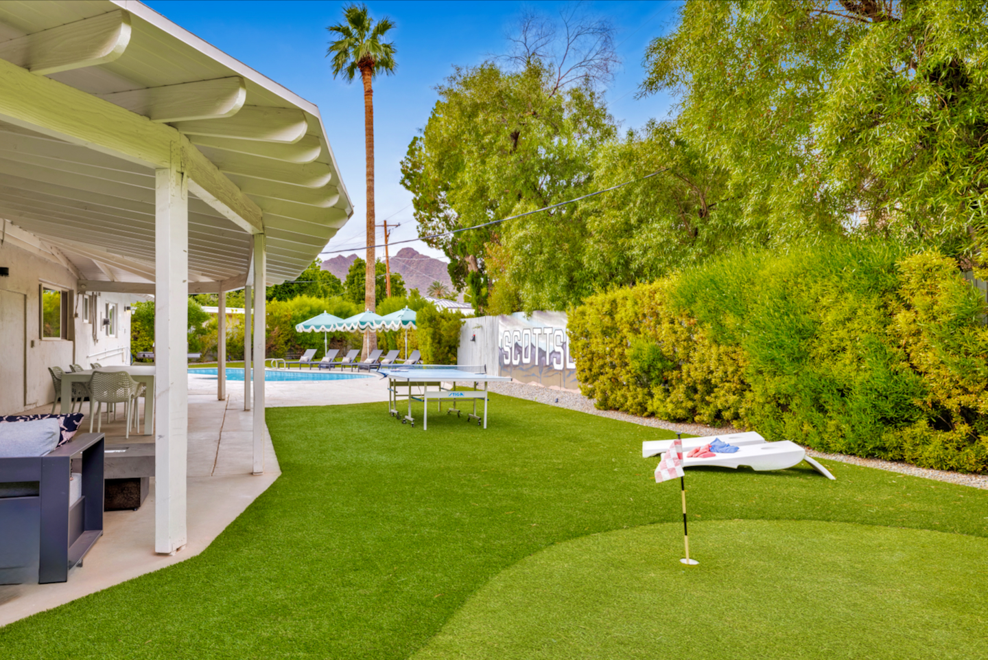 Resort-style backyard with pool, putting green, ping pong & mountain views
