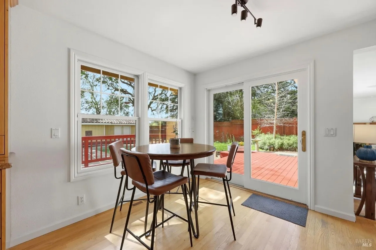 Sunny dining nook with deck access and seamless indoor-outdoor living
