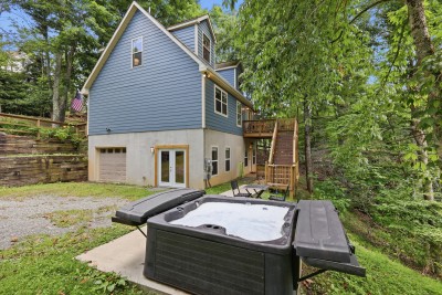 Your private woodland escape awaits! Soak in the hot tub under the pines, then unwind on the deck with peaceful forest views all around. Mountain living at its most serene, right outside your door.