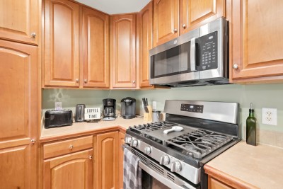 This well-equipped kitchen brings the gas range, a dedicated coffee station, and warm wood cabinets together, making it easy to fuel up for a big day on the mountain or wind down with a cup of coffee at night.