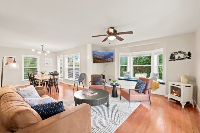 Sunlight pours through the bay window nook, lighting up an open living space made for gathering. Settle in by the fireplace, pull up a seat at the dining table, and let the mountain slow down with you.