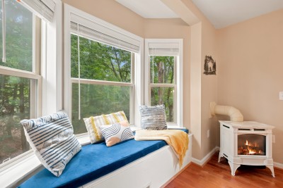 Curl up in the sunny window seat, framed by forest views, creating the perfect retreat for slow mornings or unwinding after a day on the mountain.