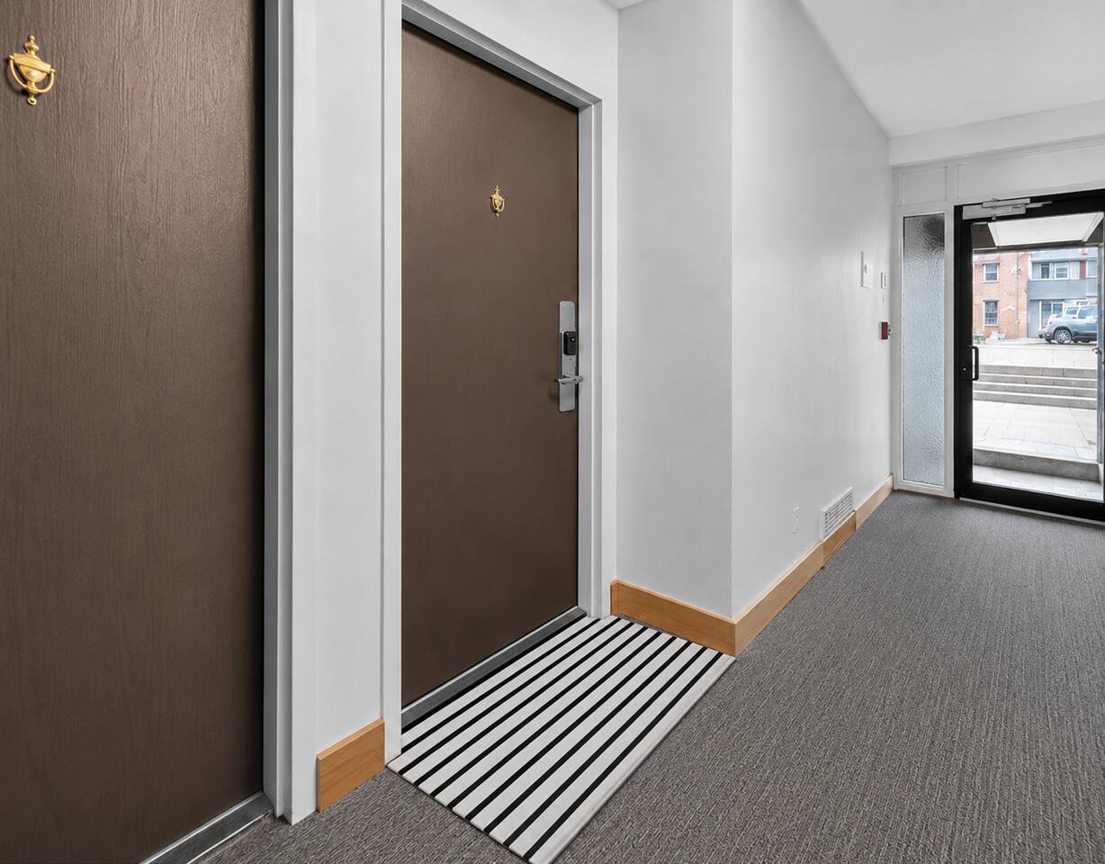 Clean, secure hallway entry with easy access to the unit