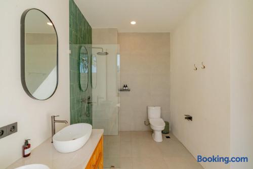 Spacious modern bathroom with double vanity and stylish glass shower
