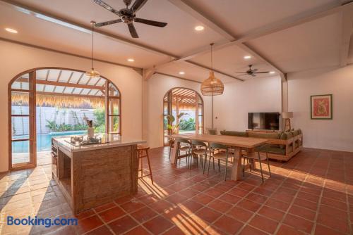 Sunlit open-plan living with pool access and warm rustic charm
